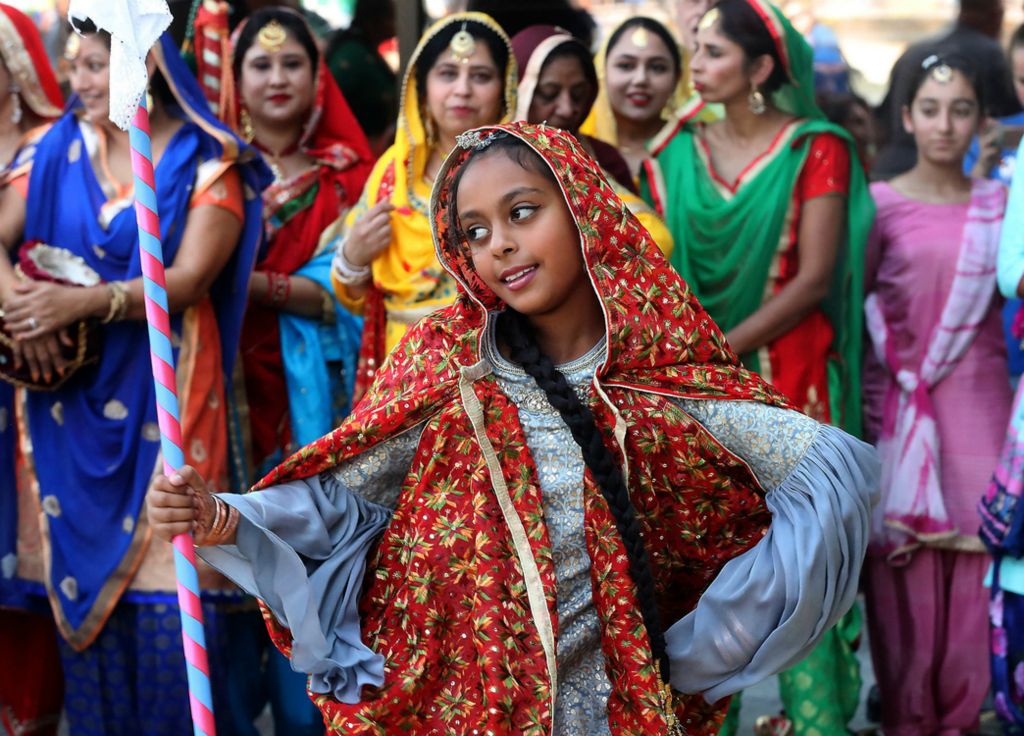 Second Place, Photographer of the Year - Small Market - Bill Lackey / Springfield News-SunA young dancer with the Punjabi Bhangra dance group starts out the group's performance Saturday during CultureFest in downtown Springfield. 