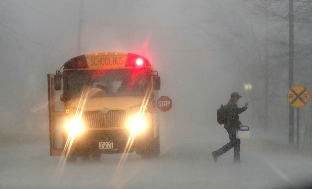 Second Place, Photographer of the Year - Small Market - Bill Lackey / Springfield News-SunA student gets off the bus on Lower Valley Pike in the middle of a down pour Thursday afternoon. 