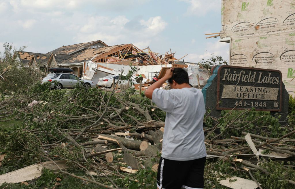 Second Place, Photographer of the Year - Small Market - Bill Lackey / Springfield News-SunA Beavercreek resident pulls his hair in frustration Tuesday as he walks through the debris left behind after an overnight tornado devastated his neighborhood. 