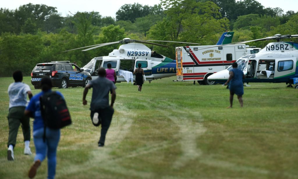 Third Place, Photographer of the Year - Small Market - Erin Caldwell / Sandusky RegisterPeople chase after an ambulance headed to the medical helicopters after an accident involving an employee at ThorWorks Industries in Perkins Township on July 15, 2019. The employee at ThorWorks fell into an industrial mixer and it took about two hours for the firefighters to free the man. He was taken by medial helicopter to a hospital.