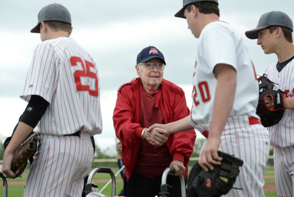 Third Place, Photographer of the Year - Small Market - Erin Caldwell / Sandusky RegisterWorld War II veteran Richard "Dick" Klein shakes hands with Huron baseball players during a field rededication ceremony at Woodlands Intermediate in Huron on Monday, May 20, 2019. The high school's baseball field is now called "Campbell-Klein Field."