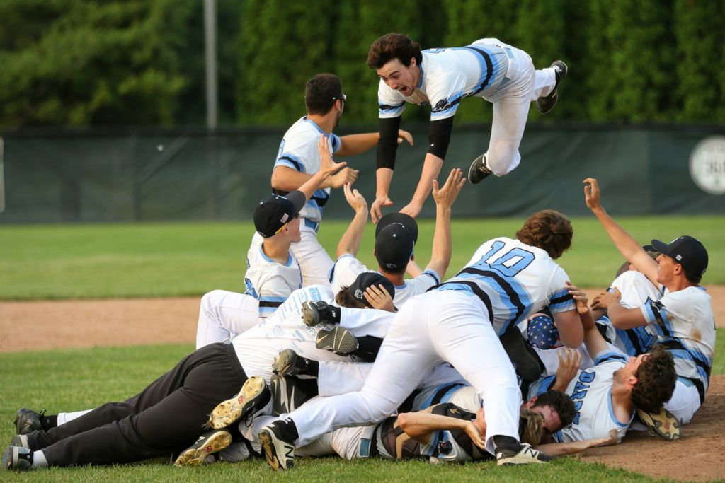 Award of Excellence, Sports Action - Alex Conrath / ThisWeek Community News, “Jumping in the Pile”Hilliard Darby’s Drew Snyder jumps onto the pile as the Panthers defeat Upper Arlington 5-3 in the Division I regional championship game.