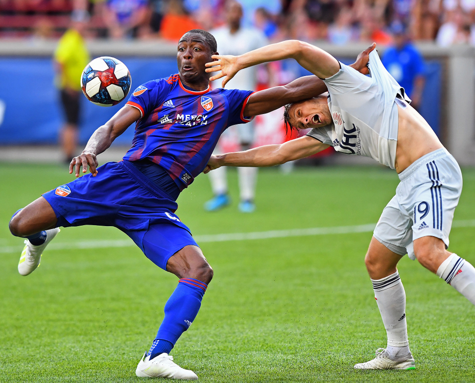 Second Place, Sports Action - Erik Schelkun / Elsestar Images, “Shot On Goal”FC Cincinnati's Fanendo Adi attempts a shot on goal while trying to hold off New England Revolution defender Antonio Milnar at Nippert Stadium in Cincinnati. 