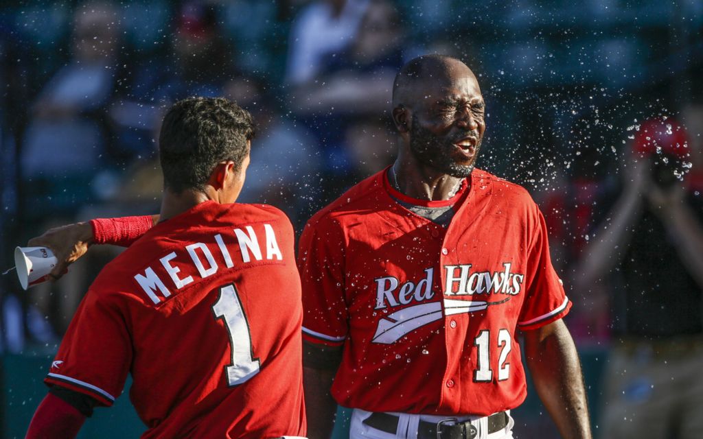 Award of Excellence, Sports Feature - Meagan Deanne / Ohio University, “Water Toss”Fargo-Moorhead RedHawks Yhoxian Medina throws water onto Devan Ahart during an American Association baseball game against the St. Paul Saints on June 28, 2019 at Newman Outdoor Field in Fargo, ND.