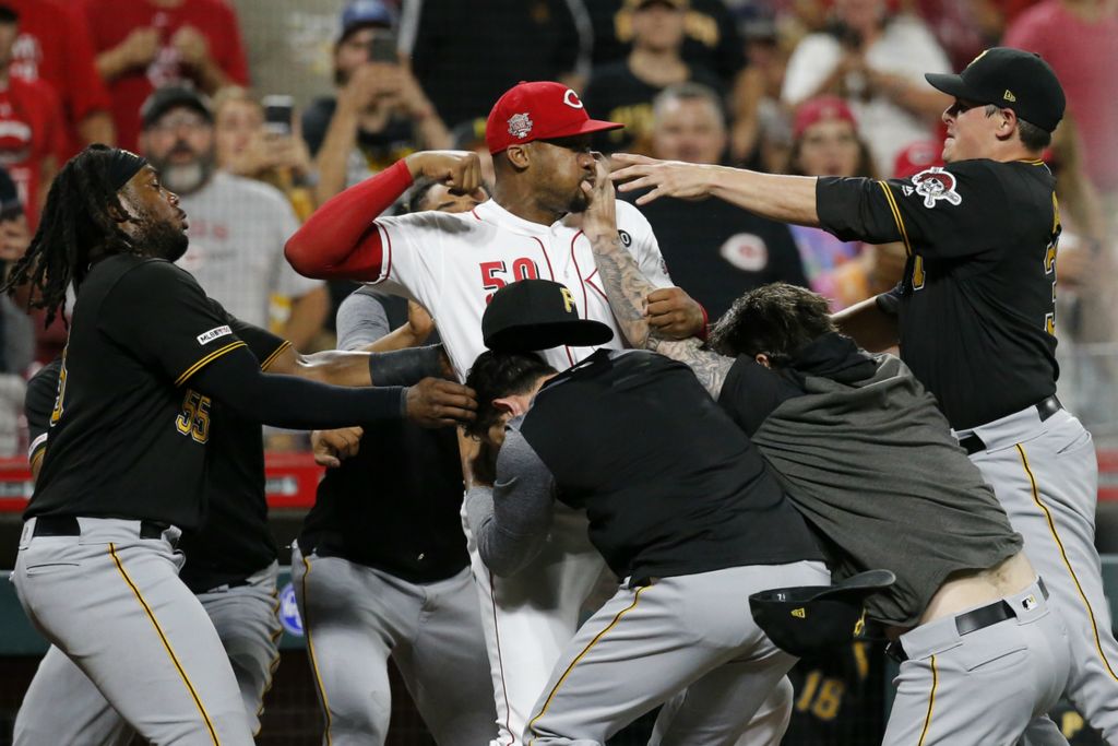 Award of Excellence, Sports Feature - Sam Greene / The Cincinnati Enquirer, “Throwing a Punch”Cincinnati Reds relief pitcher Amir Garrett (50) throws punches as he is held back by a number of Pittsburgh Pirates players as a bench clearing brawl breaks out in the ninth inning at Great American Ball Park in Cincinnati on July 30, 2019. 
