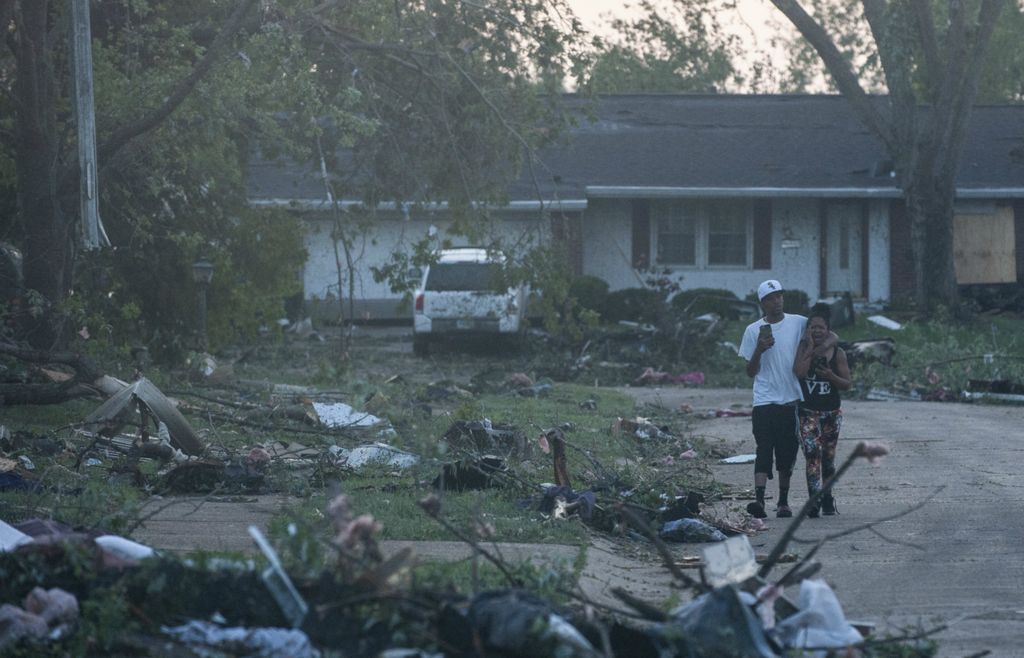 Award of Excellence, Spot News - Matthew Hatcher / Freelance, “Ruins of Trotwood”Residents of the Trotwood neighborhood West Brook inspect the damage following powerful tornados that tore through the city on May 28, 2019 in Trotwood.