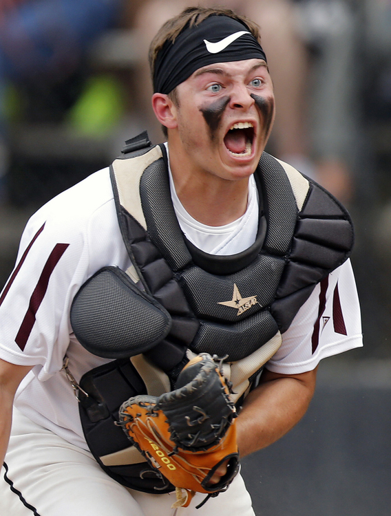 First Place, Ron Kuntz Sports Photographer of the Year - Kyle Robertson / The Columbus DispatchNew Albany's Ethan Swincicki (20) celebrates after tagging out Gahanna Lincoln's Noah Laurent (2) to win the game at home plate during the District Championship game at Ohio Dominican on May 22, 2019. 