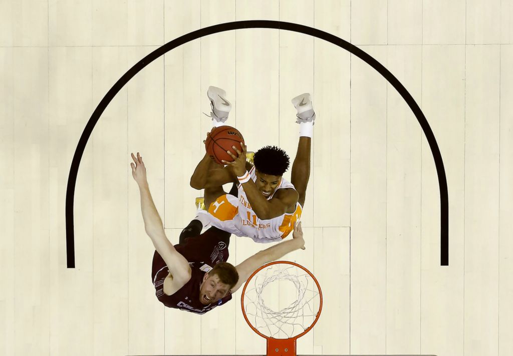 Second Place, Ron Kuntz Sports Photographer of the Year - Joshua A. Bickel / The Columbus DispatchTennessee Volunteers forward Kyle Alexander (11) shoots as Colgate Raiders forward Will Rayman (10) defends during the first half of a NCAA Division I Men's Basketball Tournament first round game between the Tennessee Volunteers and the Colgate Raiders on Friday, March 22, 2019 at Nationwide Arena in Columbus, Ohio.