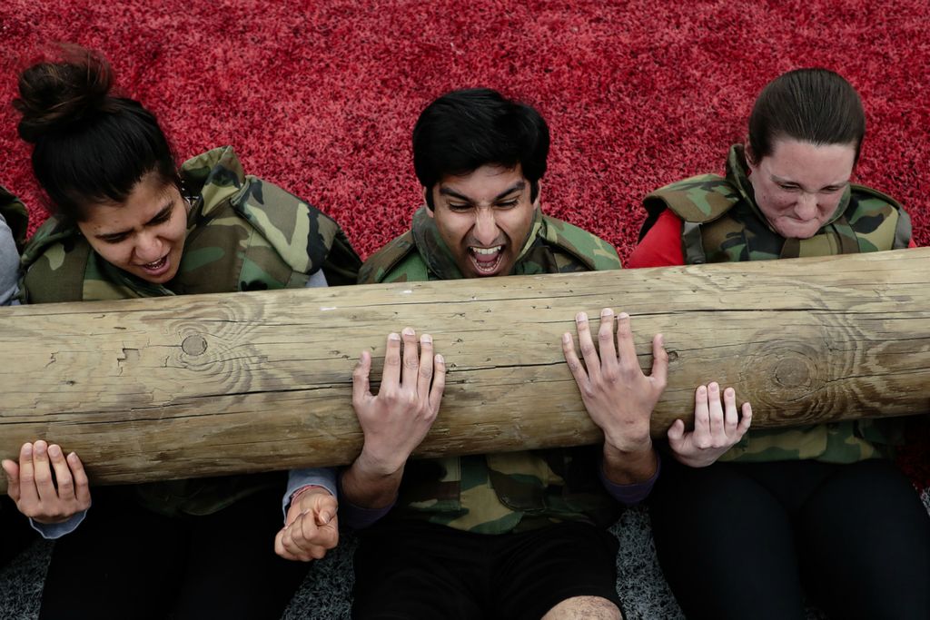 Second Place, Ron Kuntz Sports Photographer of the Year - Joshua A. Bickel / The Columbus DispatchFrom left, Shivangi Bhardwaj, Aash Bhandari and Katie Crile perform sit-ups with a 250-pound telephone pole while wearing five-pound weight vests during the Buckeye Wellness and Ohio State University ROTC 2019 Wellness Boot Camp on Wednesday, April 24, 2019 at Ohio Stadium in Columbus, Ohio. The event is designed to give students the chance to see what ROTC students experience while promoting personal fitness and wellness.