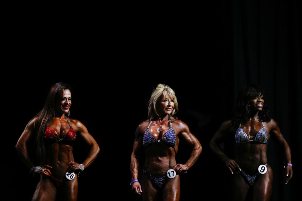 Second Place, Ron Kuntz Sports Photographer of the Year - Joshua A. Bickel / The Columbus DispatchAthletes in the Master's Figure division stand on stage during the amateur bikini competition at the Arnold Sports Festival on Thursday, February 28, 2019 at the Greater Columbus Convention Center in Columbus, Ohio.