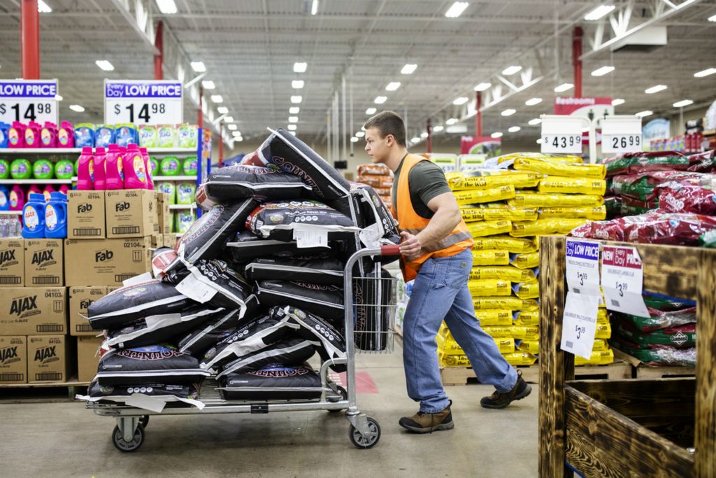 Second Place, Ron Kuntz Sports Photographer of the Year - Joshua A. Bickel / The Columbus DispatchAfter loading twenty 50-pound bags of horse feed, Garrett Ford navigates the 1,000-pound cart through aisles while working at Rural King on Wednesday, February 27, 2019 in Heath, Ohio. Garrett works part-time at the store as a loader.