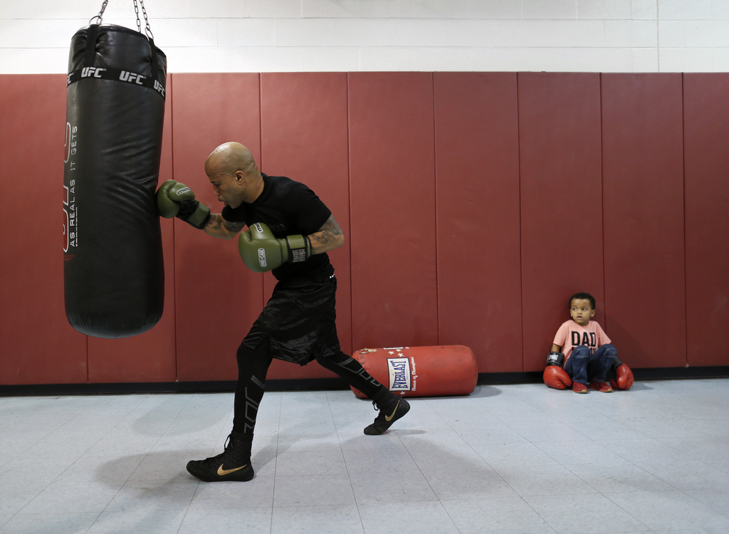 Third Place, Ron Kuntz Sports Photographer of the Year - Adam Cairns / The Columbus Dispatch5-year-old Andrew Cannon watches as boxer Jamie Walker of Columbus trains for an upcoming fight at the Douglas Community Center in Linden on Feb. 21, 2019. Walker, who has a 9-1-1 record, has a title bout against Dan Karpency of Pittsburgh during the Arnold Pro Boxing Card on March 2. 