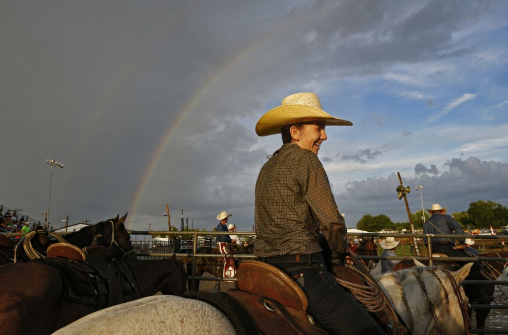Third Place, Ron Kuntz Sports Photographer of the Year - Adam Cairns / The Columbus DispatchTana Drew, 14, of Malvern, Ohio sits atop her horse while waiting out a rain delay during the Buckeye Rodeo at the Franklin County Fair in Hilliard on Tuesday, July 16, 2019. 