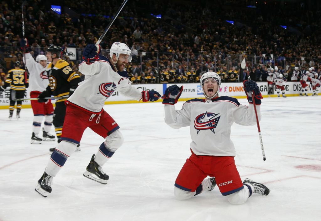 Third Place, Ron Kuntz Sports Photographer of the Year - Adam Cairns / The Columbus DispatchColumbus Blue Jackets center Matt Duchene (95) celebrates scoring the game-winner with left wing Nick Foligno (71) during the second overtime  of Game 2 of the NHL Eastern Conference semifinals against the Boston Bruins at TD Garden in Boston on Saturday, April 27, 2019. 