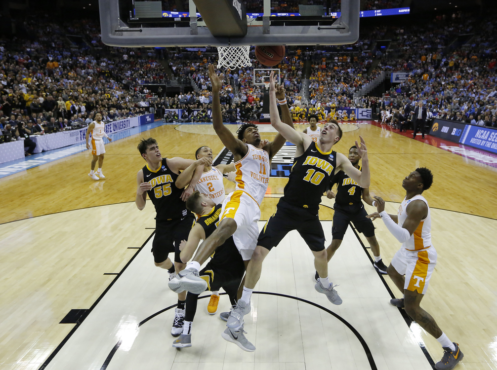Third Place, Ron Kuntz Sports Photographer of the Year - Adam Cairns / The Columbus DispatchTennessee Volunteers forward Kyle Alexander (11) and Iowa Hawkeyes guard Joe Wieskamp (10) fight for a rebound during the second half of the NCAA men's basketball tournament second-round game at Nationwide Arena in Columbus on March 24, 2019. Tennessee won 83-77. 