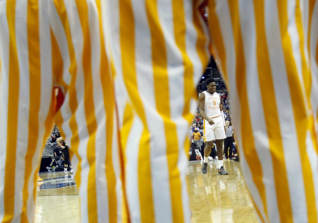 Third Place, Ron Kuntz Sports Photographer of the Year - Adam Cairns / The Columbus DispatchTennessee Volunteers guard Admiral Schofield (5) returns to the bench after hitting a shot during the first half of the NCAA men's basketball tournament second-round game against the Iowa Hawkeyes at Nationwide Arena in Columbus on March 24, 2019. 