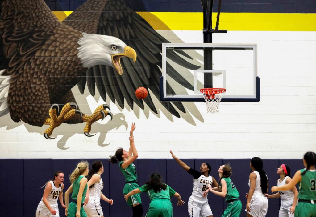 Award of Excellence, Ron Kuntz Sports Photographer of the Year - Kurt Steiss / The BladeOttawa Hills' Abbie Westmeyer (25), fourth from the left, takes a shot during a girls high school basketball game between Toledo Christian and Ottawa Hills at Toledo Christian in Toledo on Thursday, February 7, 2019. 