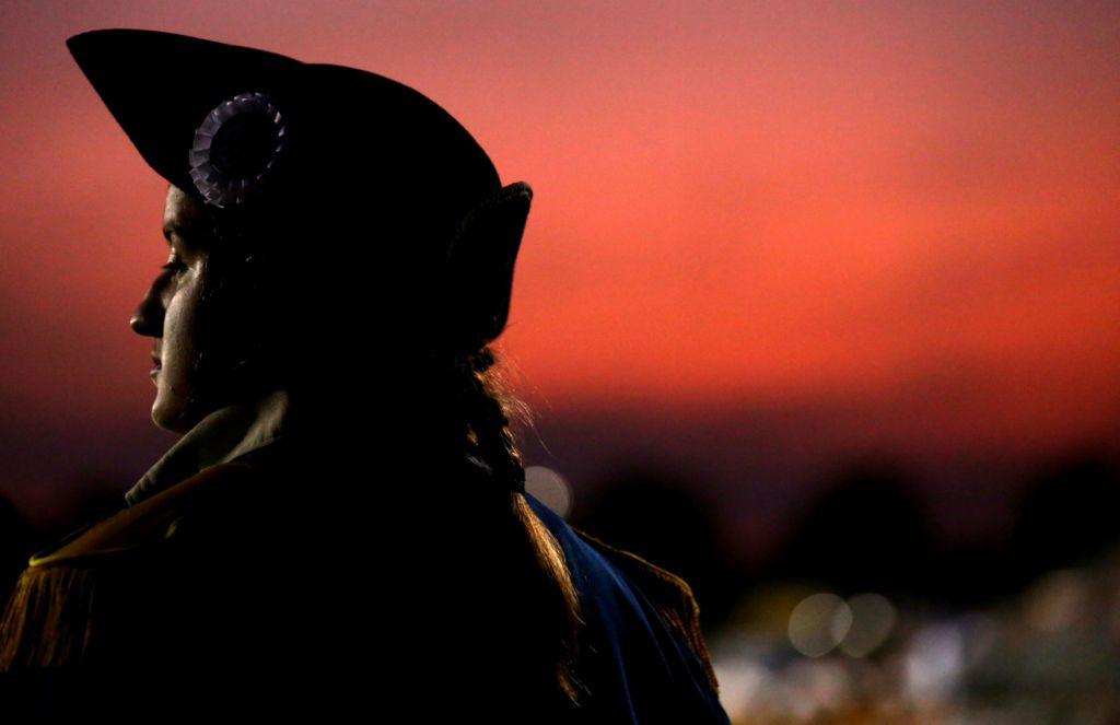 Award of Excellence, Ron Kuntz Sports Photographer of the Year - Kurt Steiss / The BladeAn Anthony Wayne band member waits to play at halftime as the sunset shows behind her during a high school football game between Anthony Wayne and Sylvania Northview at Anthony Wayne High School in Whitehouse, Ohio, on Friday, Sept. 20, 2019. 