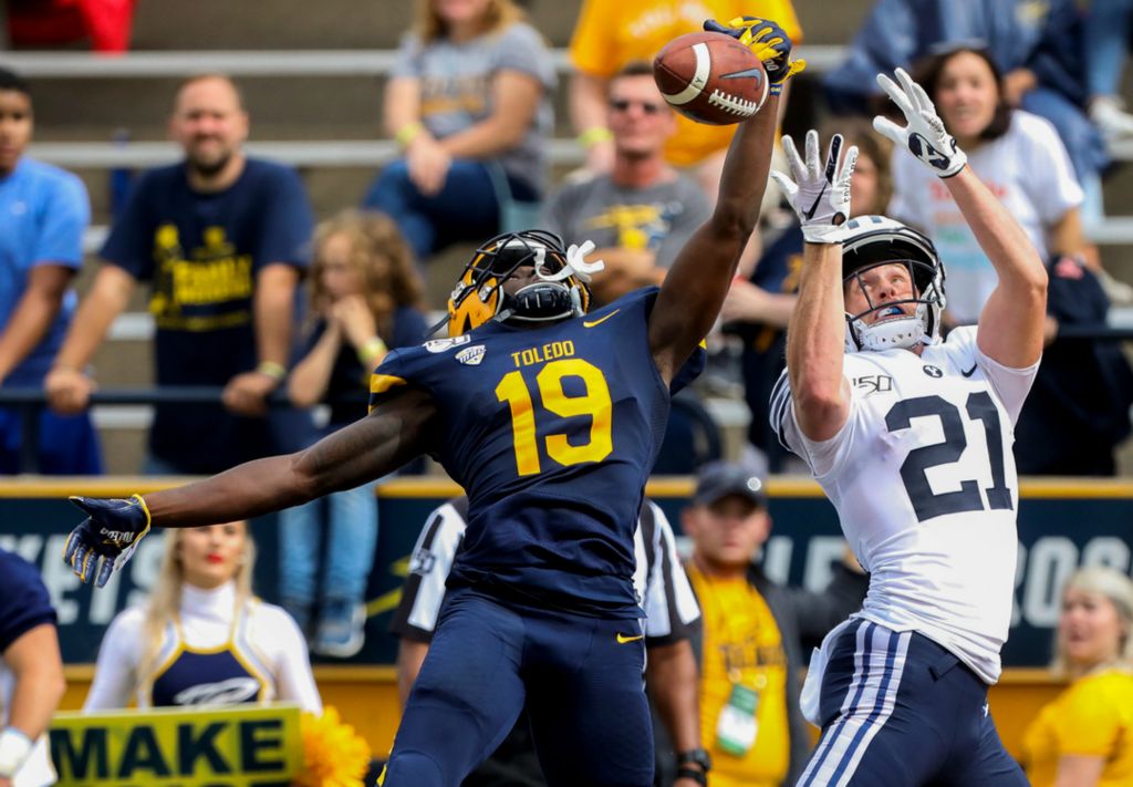 Award of Excellence, Ron Kuntz Sports Photographer of the Year - Kurt Steiss / The BladeToledo's Samuel Womack (19), left, denies the end zone pass intended for Brigham Young's Talon Shumway (21) during a college football game between the University of Toledo and Brigham Young University hosted at the Glass Bowl in Toledo on Saturday, Sept. 28, 2019. 
