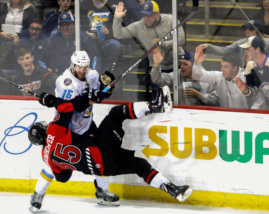 Award of Excellence, Ron Kuntz Sports Photographer of the Year - Kurt Steiss / The BladeToledo's Bryan Moore (16), back, smiles as he knocks down Cincinnati's Shaw Boomhower (65) during an ECHL hockey game between the Toledo Walleye and the Cincinnati Cyclones at the Huntington Center in Toledo on Sunday, March 31, 2019.