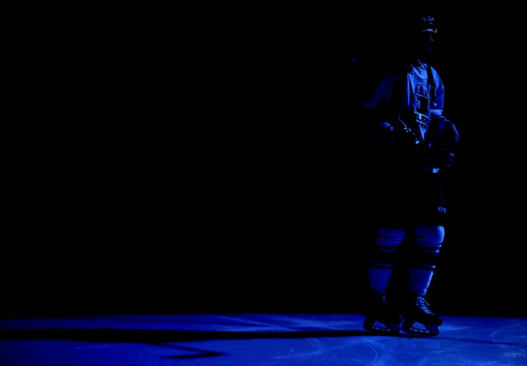 Award of Excellence, Ron Kuntz Sports Photographer of the Year - Kurt Steiss / The BladeAn Oilers player skates through a blue patch of light before the sixth game of the ECHL Western Conference finals series of Kelly Cup playoffs between the Toledo Walleye and Tulsa Oilers at the Huntington Center in Toledo on Monday, May 20, 2019.
