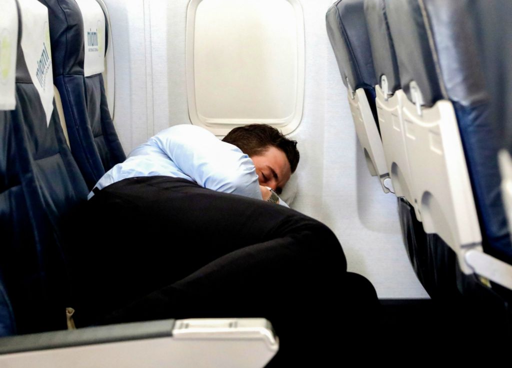 Award of Excellence, Ron Kuntz Sports Photographer of the Year - Kurt Steiss / The BladeWalleye forward Chris Crane catches up on sleep while on board the charter plane bound for Newfoundland from Ohio on Sunday, June 2, 2019. The Walleye forced a game six after defending home ice, but they had to turn around fast to head by charter plane to St. John's, Newfoundland and Labrador, Canada. 