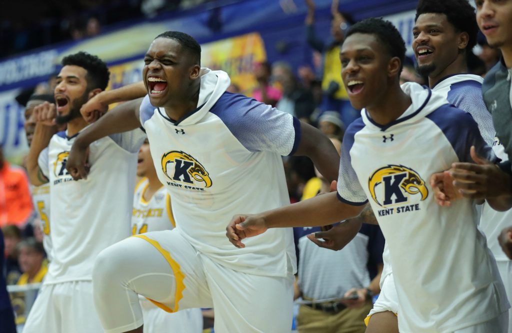 First Place, Sports Picture Story - Jeff Lange / Akron Beacon Journal, “Athlete With Autism”Kent State freshman center Kalin Bennett, left, celebrates after teammate Troy Simons threw down a dunk during the second half of Kent State's season opener against Hiram College at the MAC Center, Wednesday, Nov. 6, 2019, in Kent, Ohio.