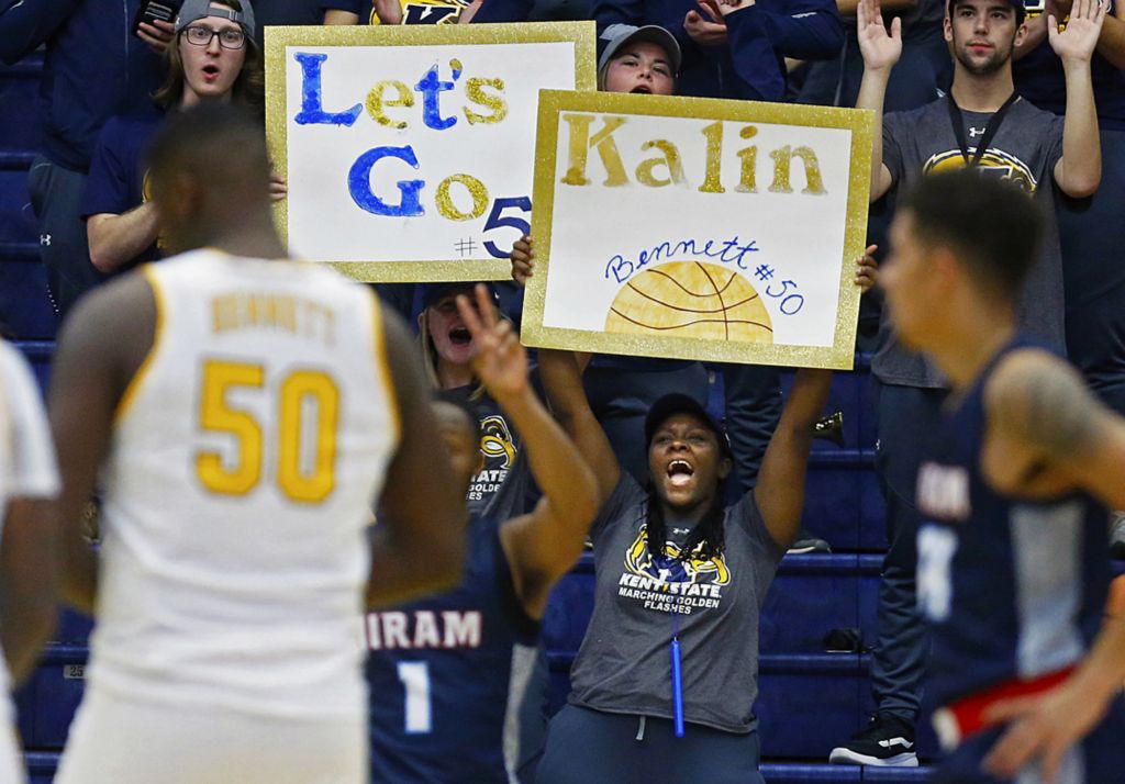 First Place, Sports Picture Story - Jeff Lange / Akron Beacon Journal, “Athlete With Autism”Fans cheer as Kent State freshman center Kalin Bennett (50) enters the game during the second half of Kent State's season opener against Hiram College at the MAC Center, Wednesday, Nov. 6, 2019, in Kent, Ohio.