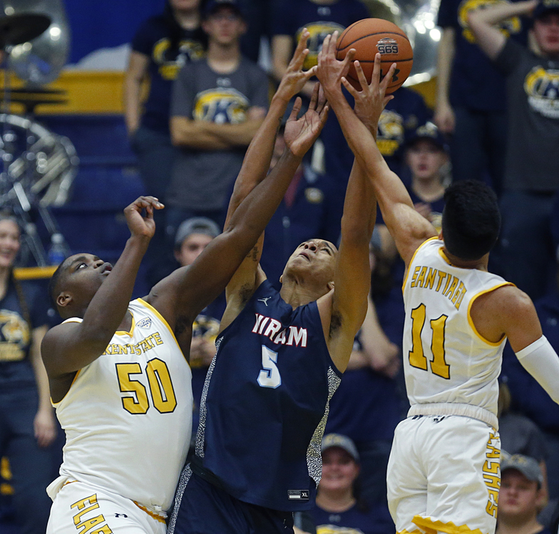 First Place, Sports Picture Story - Jeff Lange / Akron Beacon Journal, “Athlete With Autism”Kent State freshman center Kalin Bennett, left, attempts to grab a rebound against Hiram forward David Smith, center, during the second half of Kent State's season opener at the MAC Center, Wednesday, Nov. 6, 2019, in Kent, Ohio.