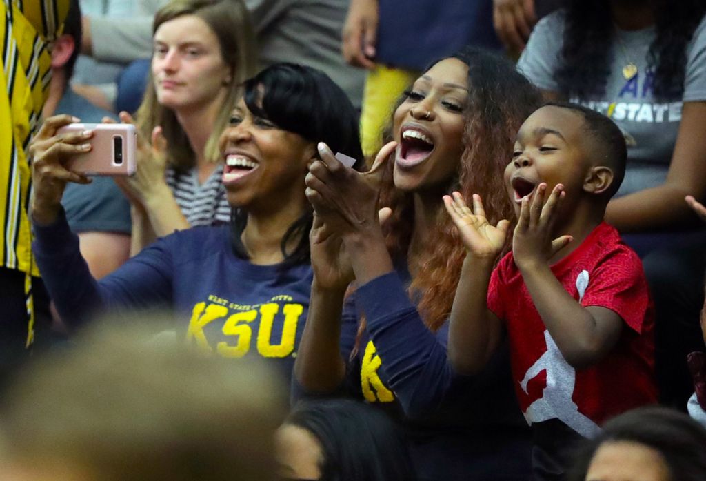 First Place, Sports Picture Story - Jeff Lange / Akron Beacon Journal, “Athlete With Autism”Sonja Bennett, center, cheers with family after her son Kalin Bennett made his first basket as a Flash during the second half of Kent State's season opener against Hiram College at the MAC Center, Wednesday, Nov. 6, 2019, in Kent, Ohio.