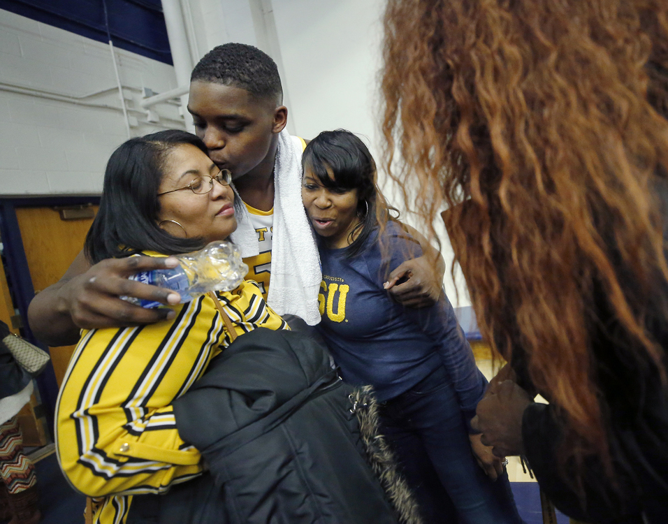 First Place, Sports Picture Story - Jeff Lange / Akron Beacon Journal, “Athlete With Autism”Kent State freshman center Kalin Bennett embraces his aunts Sabrina McCoy, left, and LaTonya Green, right, after playing in his first NCAA Division I basketball game against the Hiram College Terriers at the MAC Center, Wednesday, Nov. 6, 2019, in Kent, Ohio.
