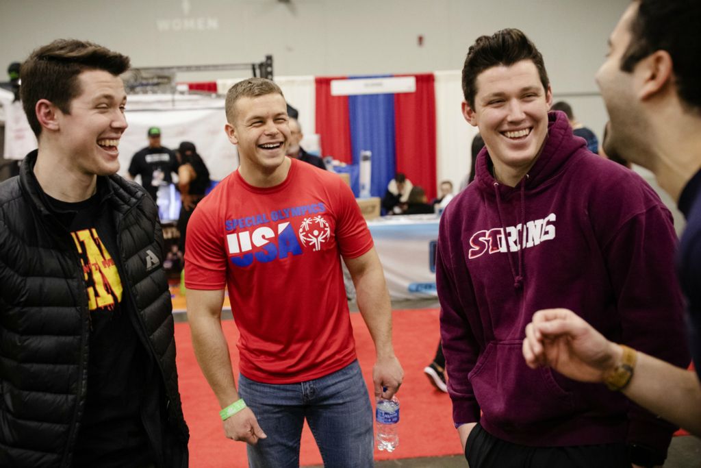 Second Place, Sports Picture Story - Joshua A. Bickel / The Columbus Dispatch, “Garrett’s Big Lift”Garrett Ford chats with from left, Andrew Fuss, Thomas Fuss and Jesse Batarseh, who he met while training at Old School Gym, while walking around at the Arnold Fitness Expo on Sunday, March 3, 2019 at the Greater Columbus Convention Center in Columbus, Ohio. Before getting into powerlifting, Garrett was shy and didn't have many friends, but lifting has grown his social circle and his confidence when interacting with others.