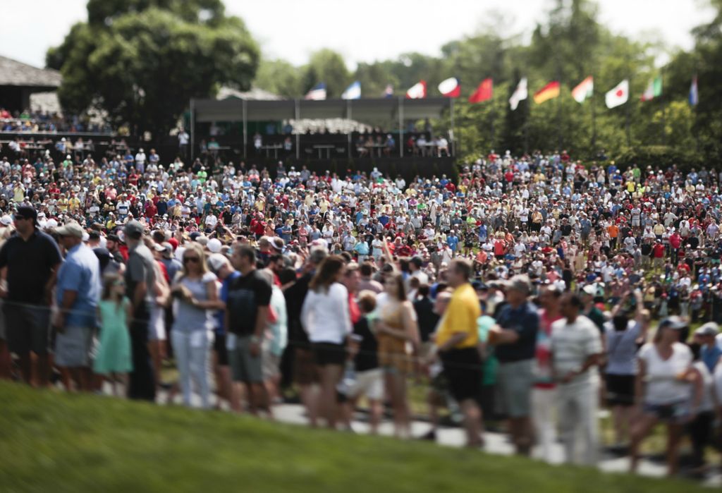 First Place, Team Picture Story - Joshua A. Bickel / The Columbus Dispatch, “Memorial Golf Tournament”Fans watch from the 18th green during the final round of the Memorial Tournament on Sunday, June 2, 2019 at Muirfield Village Golf Club in Dublin. 