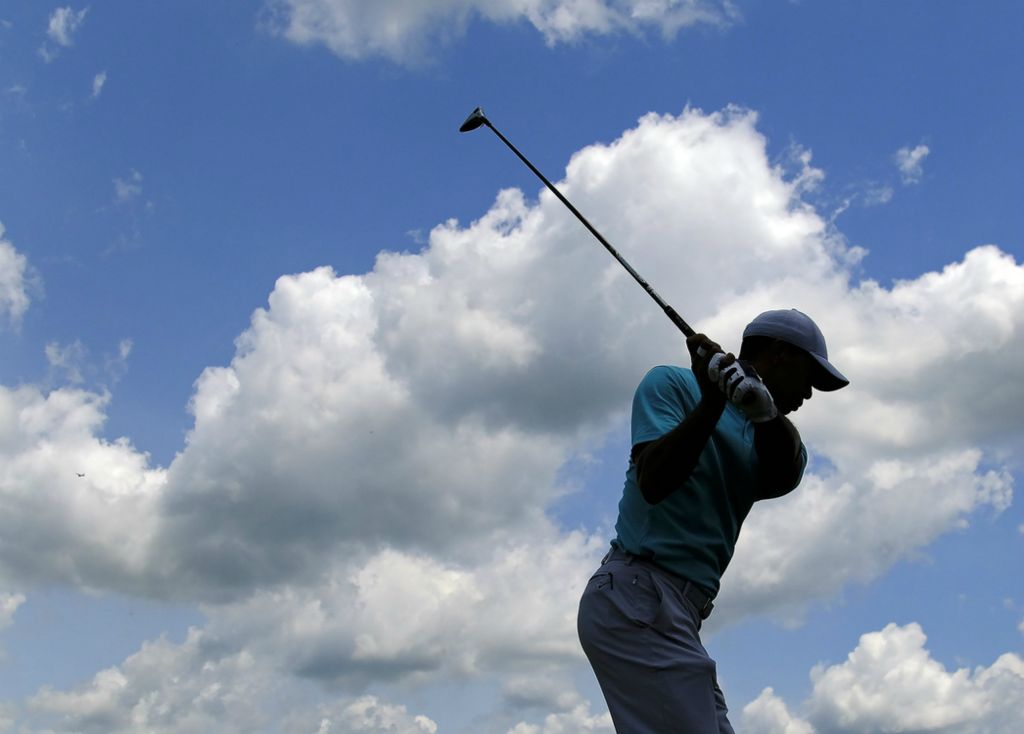 Second Place, Team Picture Story - Adam Cairns / The Columbus Dispatch, “Tiger”Tiger Woods tees off on the 1st hole during the second round of the Memorial Tournament at Muirfield Village Golf Club in Dublin on May 31, 2019. 