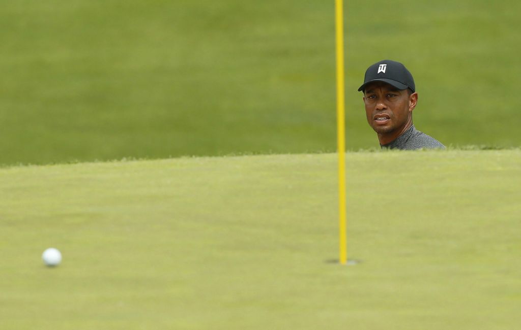 Second Place, Team Picture Story - Adam Cairns / The Columbus Dispatch, “Tiger”Tiger Woods watches his chip shot out of the bunker on the 18th hole during the Nationwide Invitational Pro-Am at the Memorial Tournament at Muirfield Village Golf Club in Dublin, on May 29, 2019. 