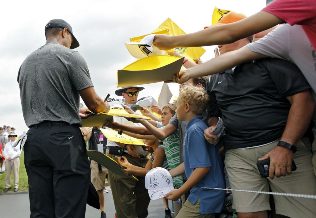 Second Place, Team Picture Story - Kyle Robertson / The Columbus Dispatch, “Tiger”Tiger Woods signs autographs after the National Invitational Pro-Am at the Memorial Tournament at Muirfield Village Golf Club in Dublin, on May 29, 2019.