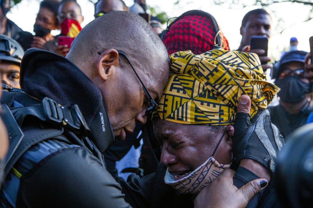 Second Place, Chuck Scott Student Photographer of the Year - Michael Blackshire / Ohio UniversityThe Not F’ing Around Coalition leader John Johnson who goes by Grandmaster Jay, left, embraces with a follower after speaking in a park in Louisville, Kentucky during Derby weekend on September 5th, 2020, to discuss justice for Breonna Taylor. “We come here not for violence, not to harm or burn any buildings, we are here for justice,” Johnson said. 