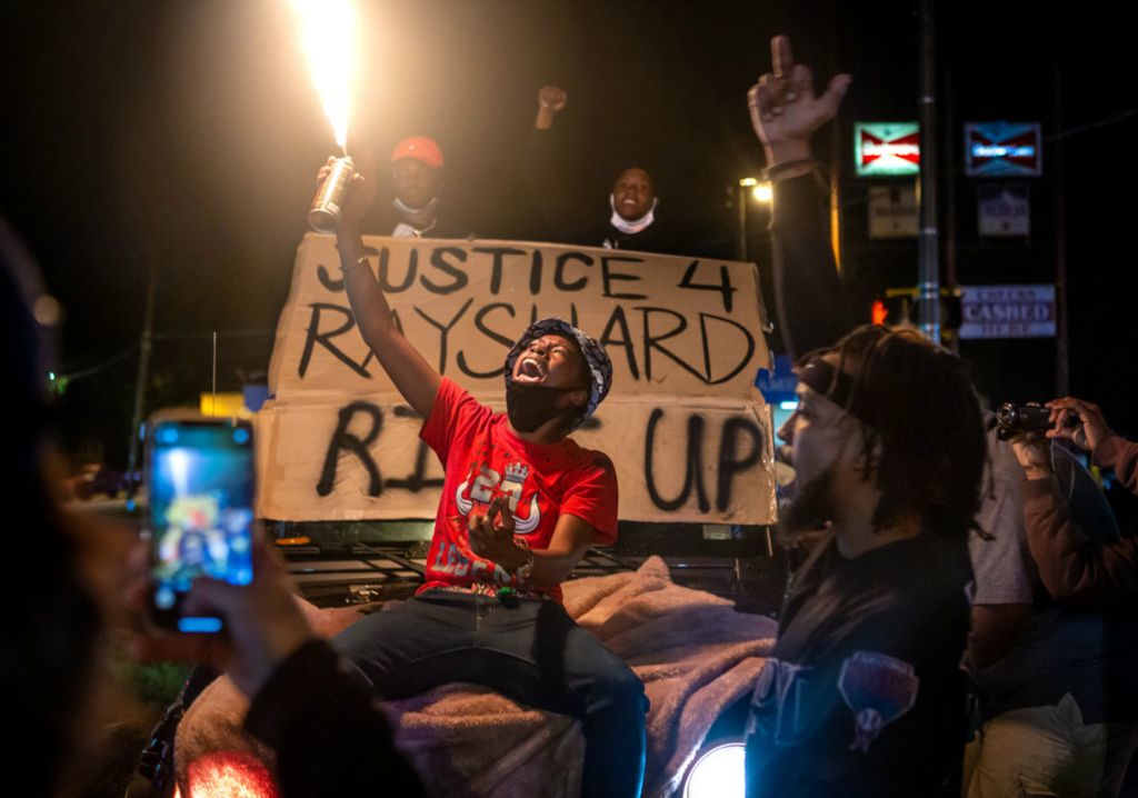 Second Place, Chuck Scott Student Photographer of the Year - Michael Blackshire / Ohio UniversityTwo nights after the death of Rayshard Brooks, protestors stormed the intersection of Pryor Avenue on June 14, 2020. Without any Atlanta police in sight, a few in the crowd stormed the gas station next door to the Wendy’s with intentions to loot, but another group of people persuaded the crowd to not follow through with it. Instead, a few protesters decided to loot at the Lenox Square, while some went back home and others stayed through the night to protest.