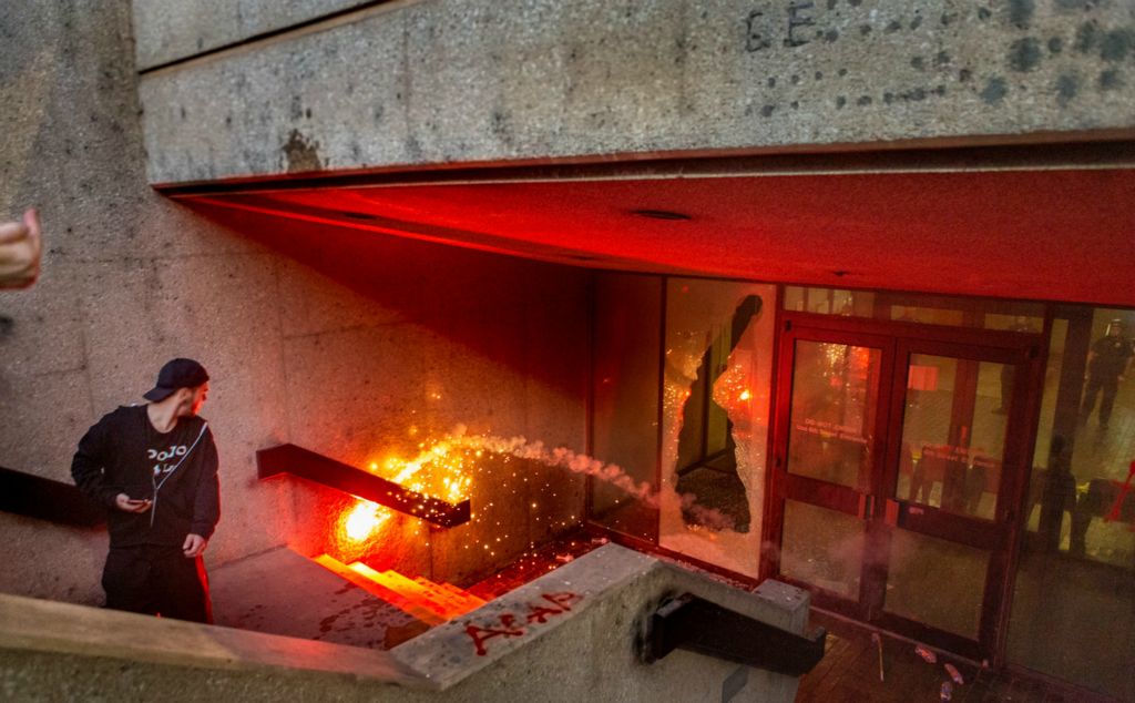 Second Place, Chuck Scott Student Photographer of the Year - Michael Blackshire / Ohio UniversityA protester throws firecrackers inside the old courthouse in downtown Louisville, Ky on May 29th, 2020. People surrounded the building and threw rocks and fireworks into the building before Louisville police threw tear gas to disperse the crowd. Hundreds surrounded the courthouse and the Louisville Police Department headquarters while throwing firecrackers, rocks and bottles through the windows. The community in Louisville followed up with protesting after the initial uprising in Minneapolis in response to George Floyd’s death. Louisville already had their own ongoing issue with the shooting death of Breonna Taylor, but the tension during the last week of May 2020 led to intense protest and rioting in the city.