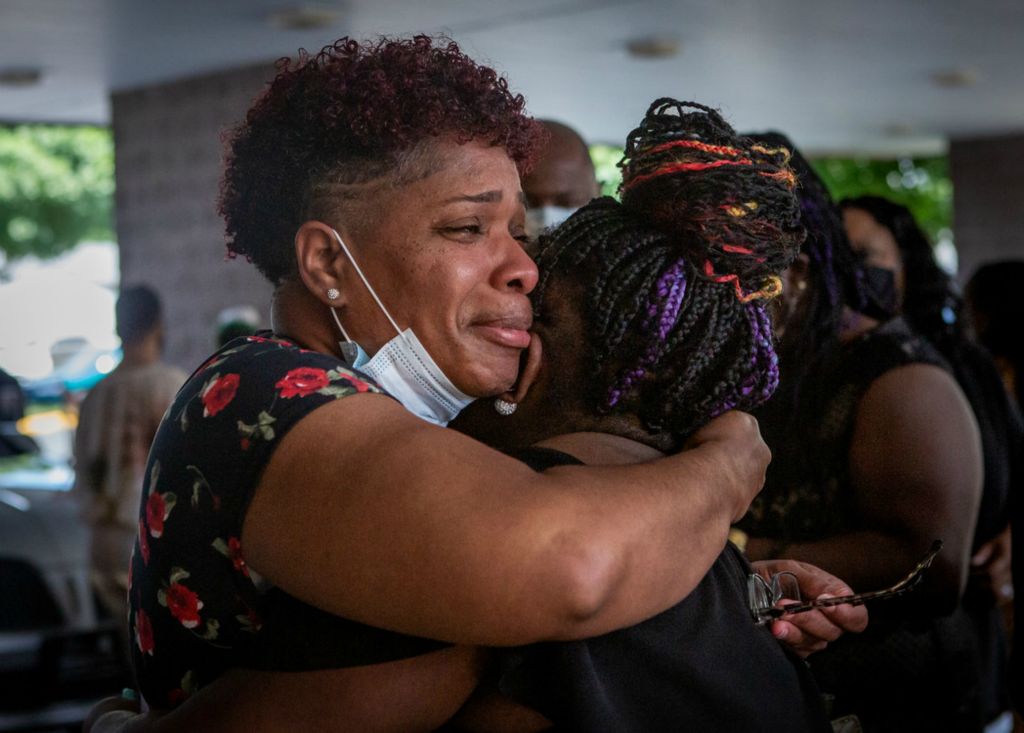 Second Place, Chuck Scott Student Photographer of the Year - Michael Blackshire / Ohio UniversityNechell Reynolds hugs a family member during the funeral of David McAtee in Louisville, Ky., on June 13, 2020. McAtee died when a stray bullet from a Kentucky National Guard officer hit David McAtee chest during curfew in Louisville’s West End. "This one hurts, he didn't even know what was going on," Reynolds said. 