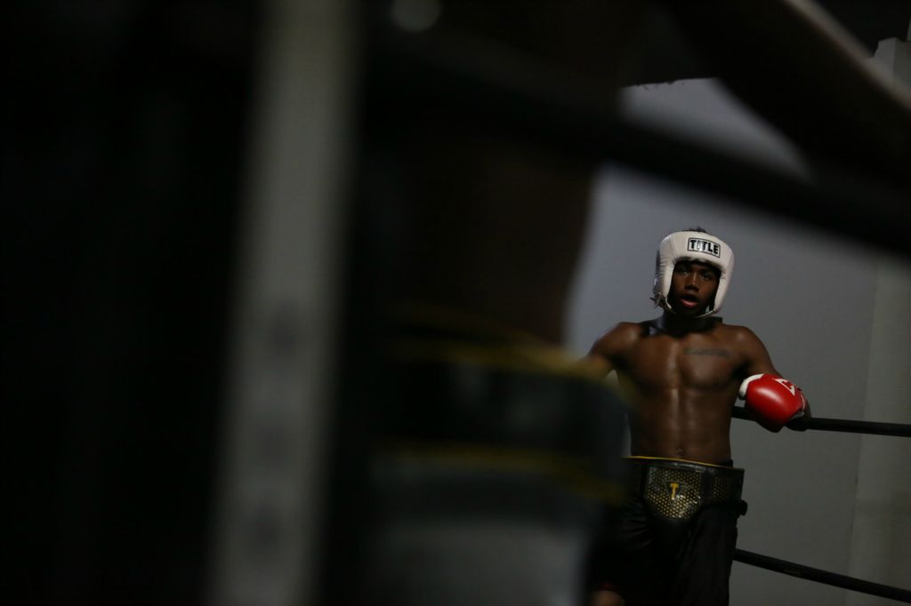 Second Place, Chuck Scott Student Photographer of the Year - Michael Blackshire / Ohio UniversityDemontaze Duncan, 18, is a teen boxer who is planning on going pro next year. Duncan has been training with his coach for over four years, and plans to be a boxing champion in the middleweight boxing category. Growing up in a rough environment, he now plans to follow a career that takes him to a career he has desired since he was 13. First Caption: Demontaze Duncan, 18, takes a break before going into another practice boxing round with Joseph Hurt on October 17, 2020. Duncan is a top ranked boxer in Louisville and spend most of his days practicing with other Louisville boxers. He is coached by Nicholas Bareis, who is his father figure and coach.