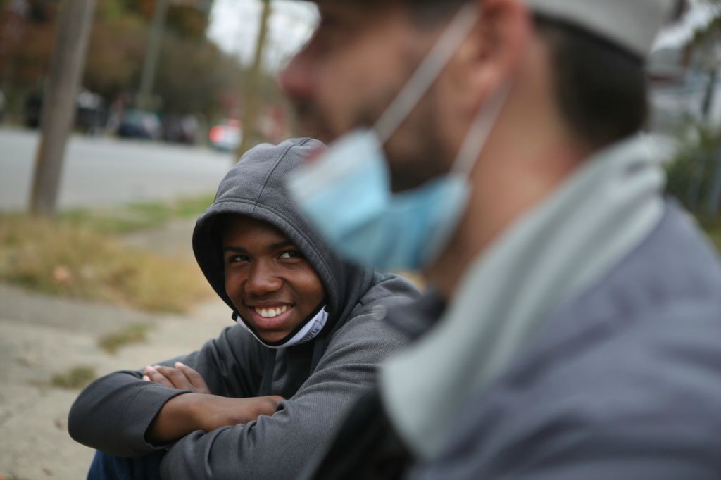Second Place, Chuck Scott Student Photographer of the Year - Michael Blackshire / Ohio UniversityDemontaze Duncan, 18, talks to his coach and mentor Nicholas Bareis in the Westend of Louisville while campaigning for Democratic senator nominee Amy McGrath on October 18, 2020. 