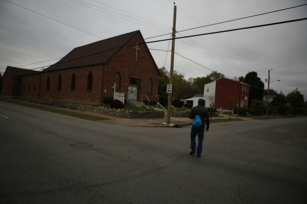 Second Place, Chuck Scott Student Photographer of the Year - Michael Blackshire / Ohio UniversityDemontaze Duncan, 18, crosses the street during work in Louisville, Kentucky on October 18, 2020. 