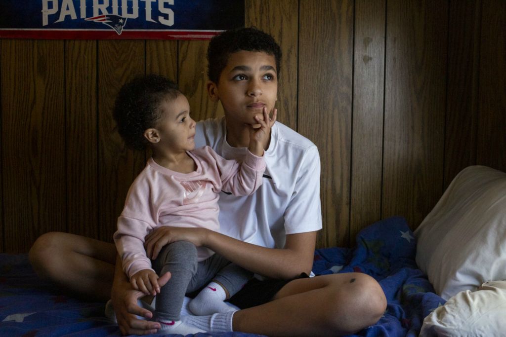 Third Place, Chuck Scott Student Photographer of the Year - Lauren Santucci / Ohio UniversityShawn Thorpe and his sister, Dior Aduna, sit in their house trailer in The Plains, Ohio. “I’m like a father figure to her,” Shawn says about his sister. Dior’s father passed away three days before she was born. Shawn and Dior are raised by their single mother, Crystal, who earns just under $11,000 a year.