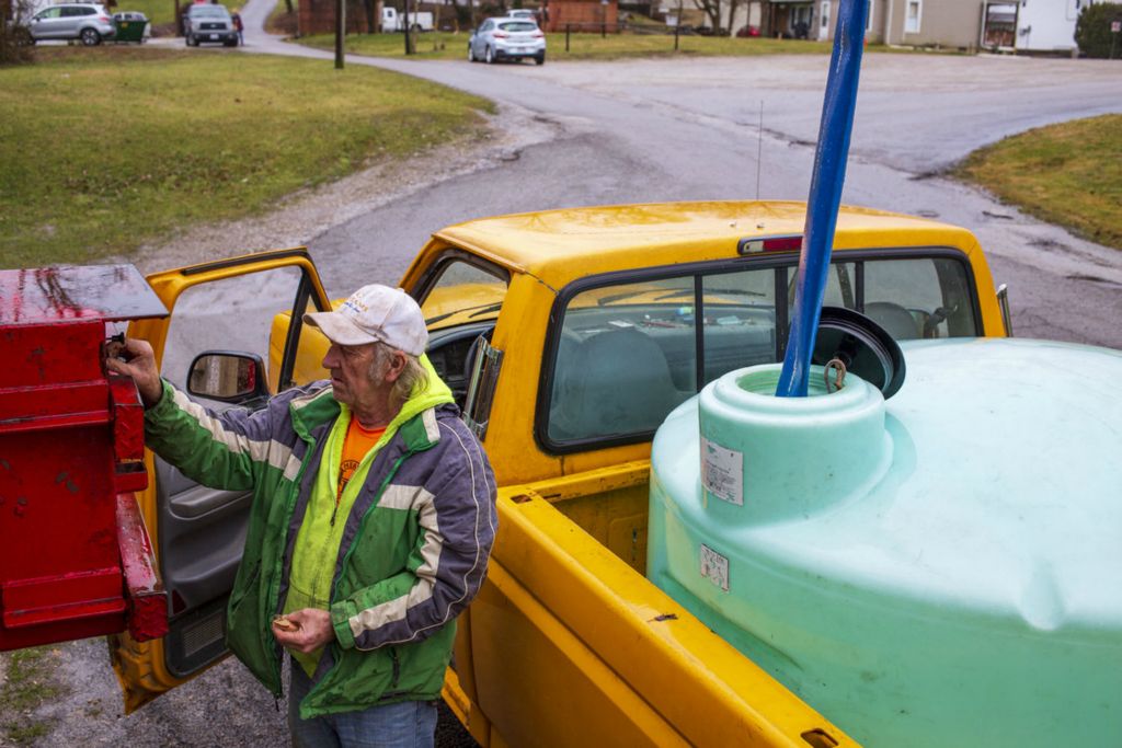 Third Place, Chuck Scott Student Photographer of the Year - Lauren Santucci / Ohio UniversityJohn Singree hauls water in a 400-gallon tank he fills once a week to have water for plumbing, washing dishes, and doing laundry at home. There is a filling station in the center of town where residents who are not connected to the village water system can fill their bottles or tanks. “It doesn’t bother me, I’m used to it,” John says.  