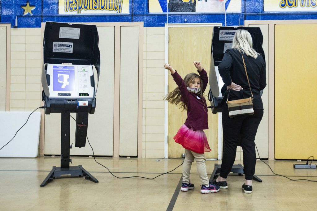 Award of Excellence, Election 2020 - Rebecca Benson / The Blade, “Dancing ”Annalise Ramirez, 5, dances as she waits for her mom Amanda to finish voting at Washington Local Schools Administration Building in Toledo on November 3, 2020. 