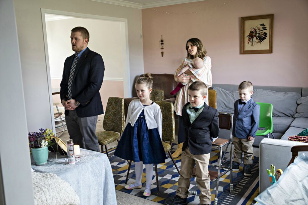 Third Place, Feature - Albert Cesare / The Cincinnati Enquirer, “Faith Coronavirus Pandemic ”Glenn and Lara Gigandet watch a live streamed Mass with their children Dorothy, 6, Charles, 5, Paul, 3, and Mabel, five-month-old, on Sunday, March 22, 2020 at their home in Mason. The Archdiocese of Cincinnati suspended all public Masses due to the new coronavirus pandemic. A family attempted to create a new normal during the pandemic, to me sums up how the new coronavirus impacted all of our lives. 