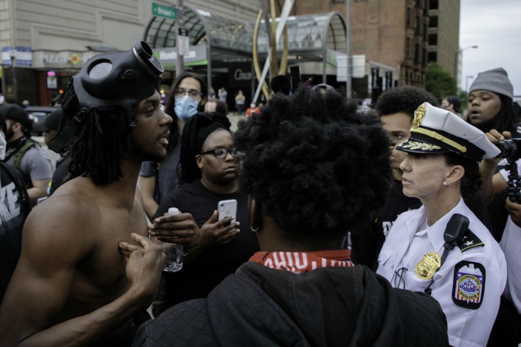 Second Place, News Picture Story - Joshua A. Bickel / The Columbus Dispatch, “George Floyd Protests”A protester questions Columbus Division of Police Deputy Chief Jennifer Knight as protests continue following the death of Minneapolis resident George Floyd on Monday, June 1, 2020 in Columbus, Ohio. After two days of standoffs with police officers clad in riot gear and armed with tear gas and rubber bullets, Police leadership came out unarmed to the protests to listen and attempt to quell tensions.
