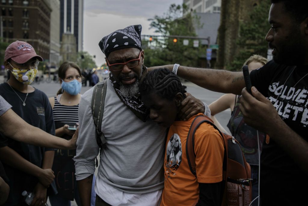 Second Place, News Picture Story - Joshua A. Bickel / The Columbus Dispatch, “George Floyd Protests”Delton Boyd Jr., center, of Columbus, begins to cry as he embraces his son, Delton III, 14, while sharing his experiences with racism to Columbus Division of Police Deputy Chief Jennifer Knight, not pictured, as protests continue following the death of Minneapolis resident George Floyd on Monday, June 1, 2020 in Columbus, Ohio. 