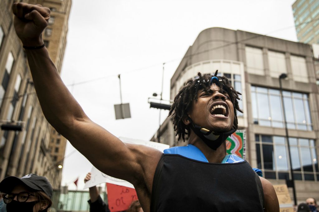 Award of Excellence, News Picture Story - Meg Vogel / The Cincinnati Enquirer, “BLM Protest”Sancheaux leads a chant on Fountain Square in downtown Cincinnati on Monday, June 1, 2020. This is the fourth night of protests in response to the death of George Floyd in Minneapolis.